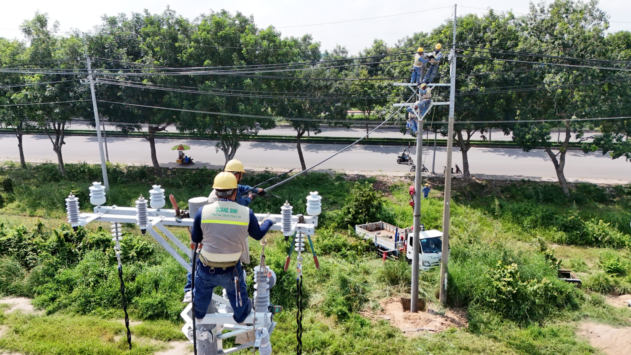 Technicians inspecting and testing electrical systems.